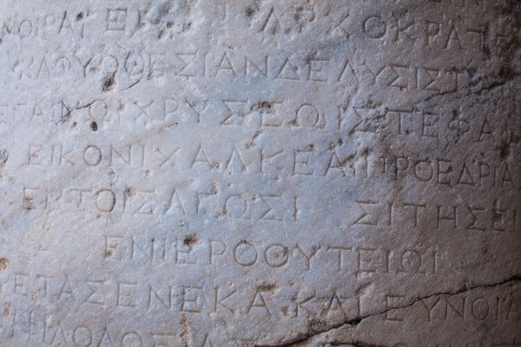 Photo of the limestone inscriptions in ancient Greek at the Acropolis of Lindos Rhodes