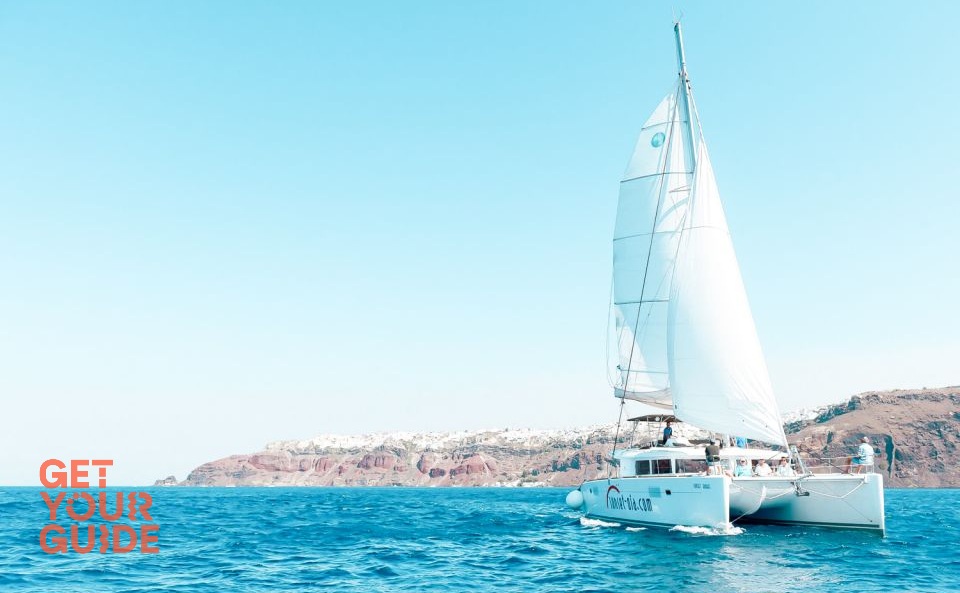 Santorini catamaran tour with BBQ meal and unlimited drinks
