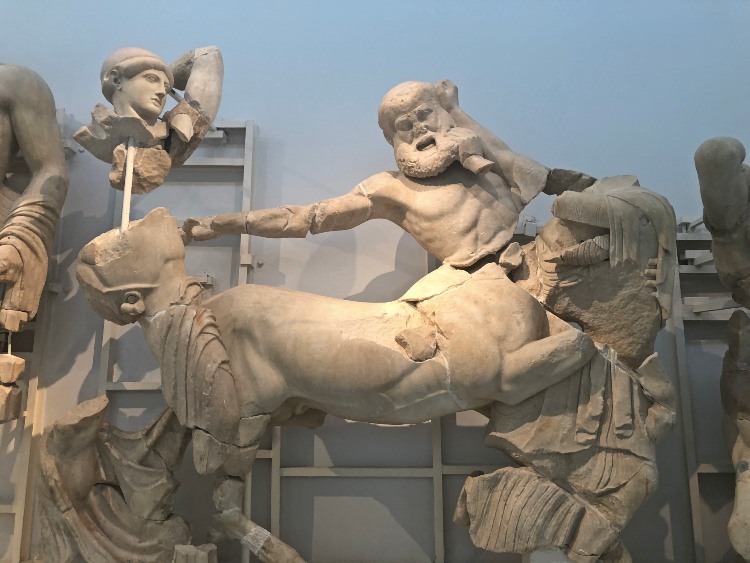 A pediment of the Temple of Zeus in the Archaeological Museum of Olympia including a statue of a horse