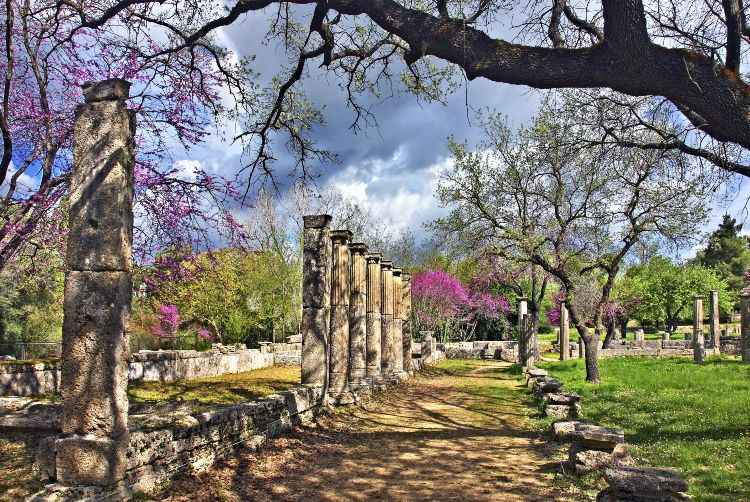 The Palaestra of Olympia in spring with purple flowering trees